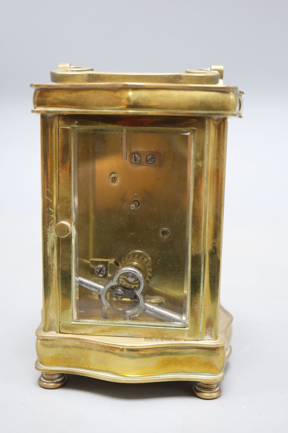 A brass carriage timepiece, height 13cm (handle down)